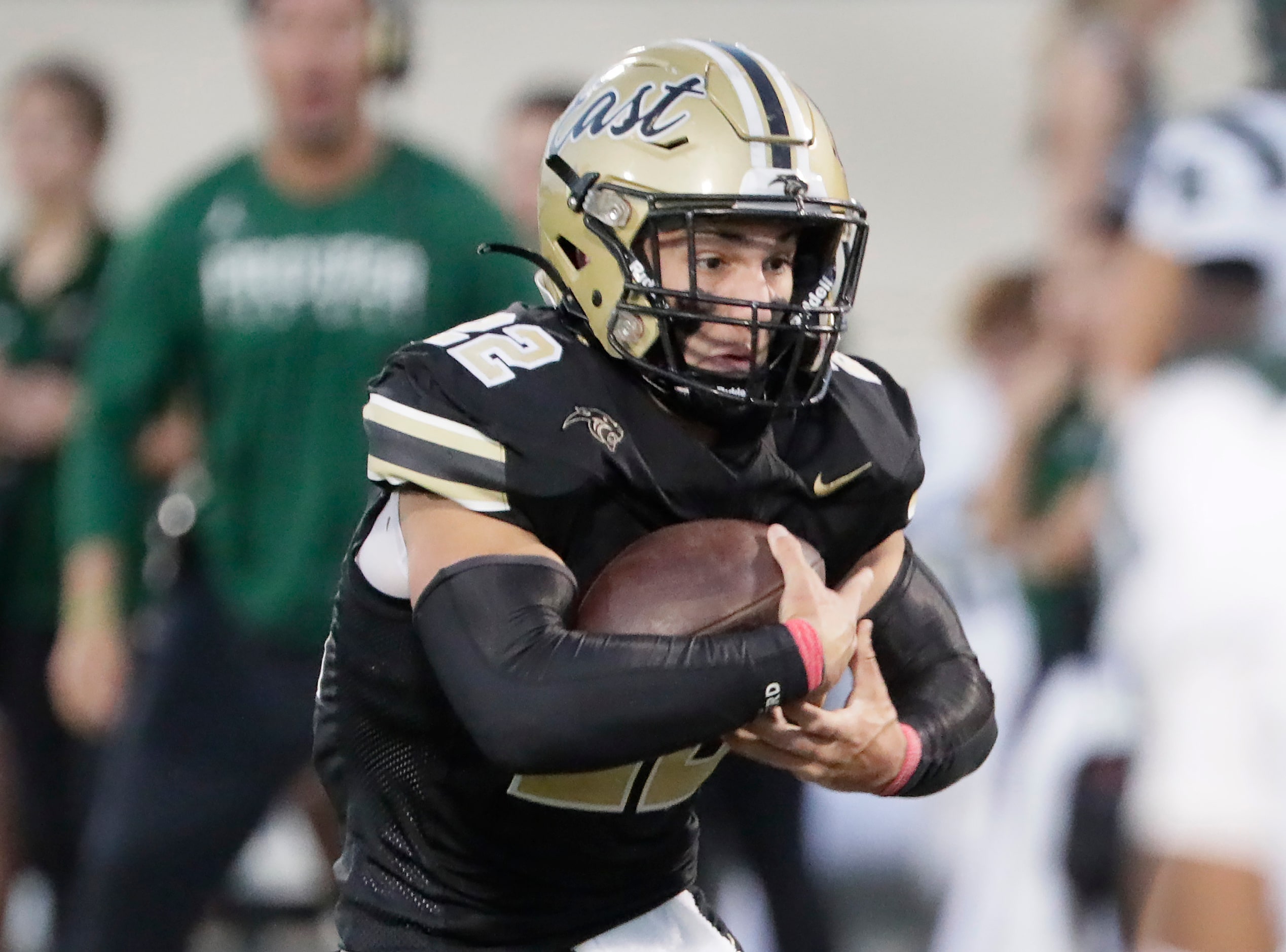 Plano East High School running back Travis Agee (22) carries the football during the first...