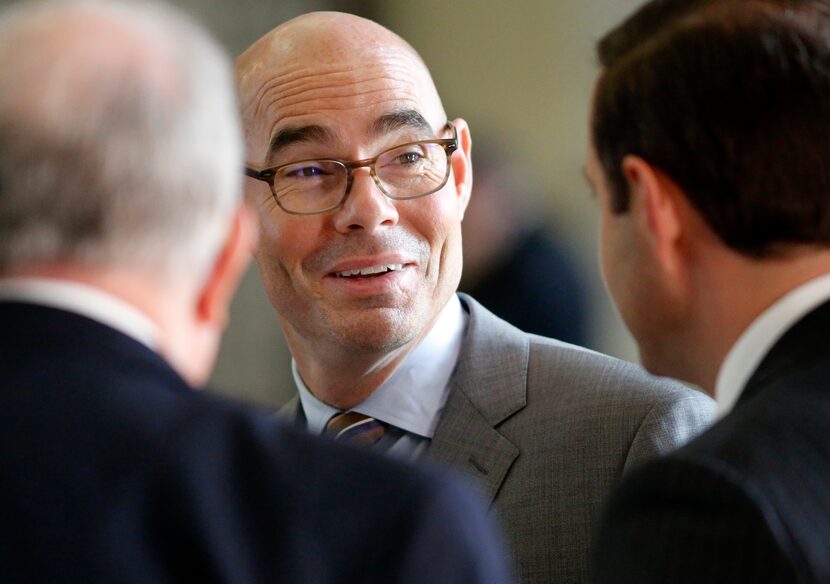 Texas Speaker of the House Honorable Dennis Bonnen (center) visits with colleagues during...