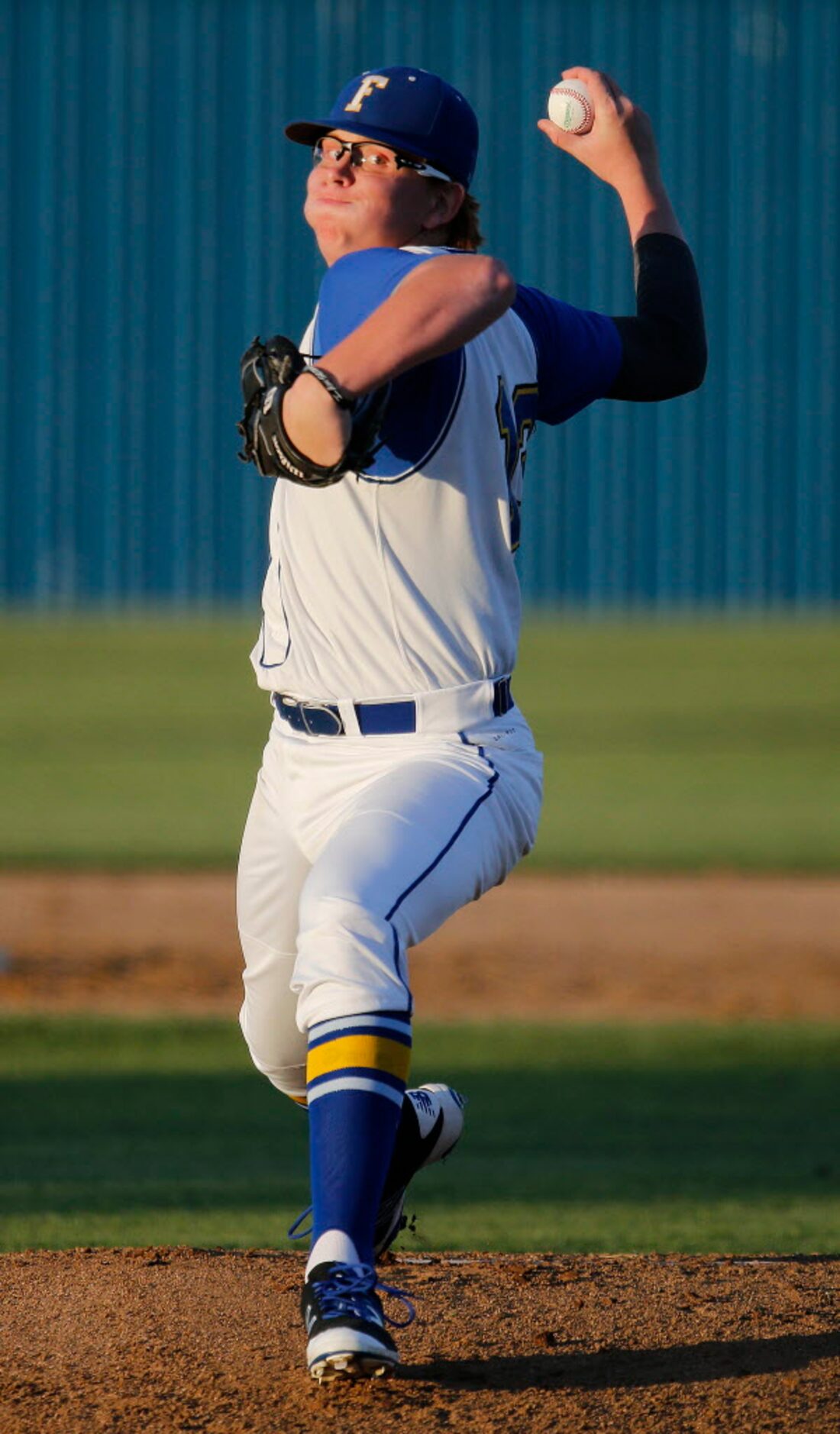 Frisco High School pitcher Jacob Garrity (13) delivers a pitch in the first inning as Frisco...