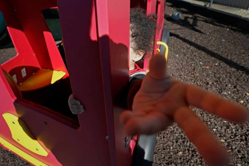 A child plays at a playground of Hope's Door in Plano that offers a shelter and counseling...