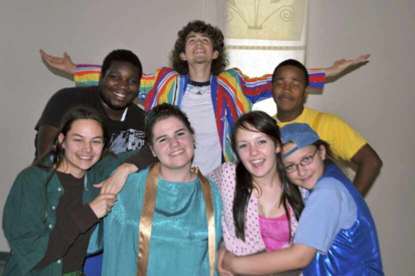 Benjamin Wright (center, arms out) and members of his Godspell cast.
