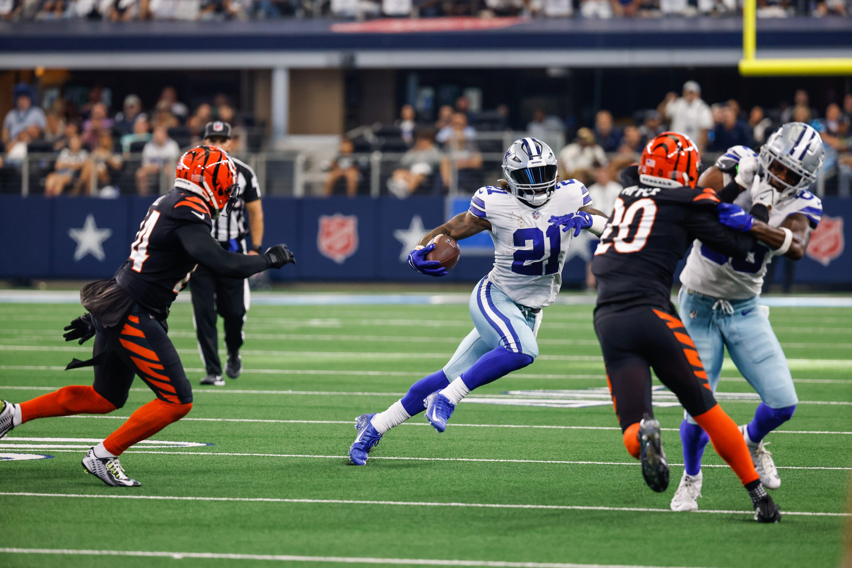 Dallas Cowboys running back Ezekiel Elliott (21) runs with the football against the...