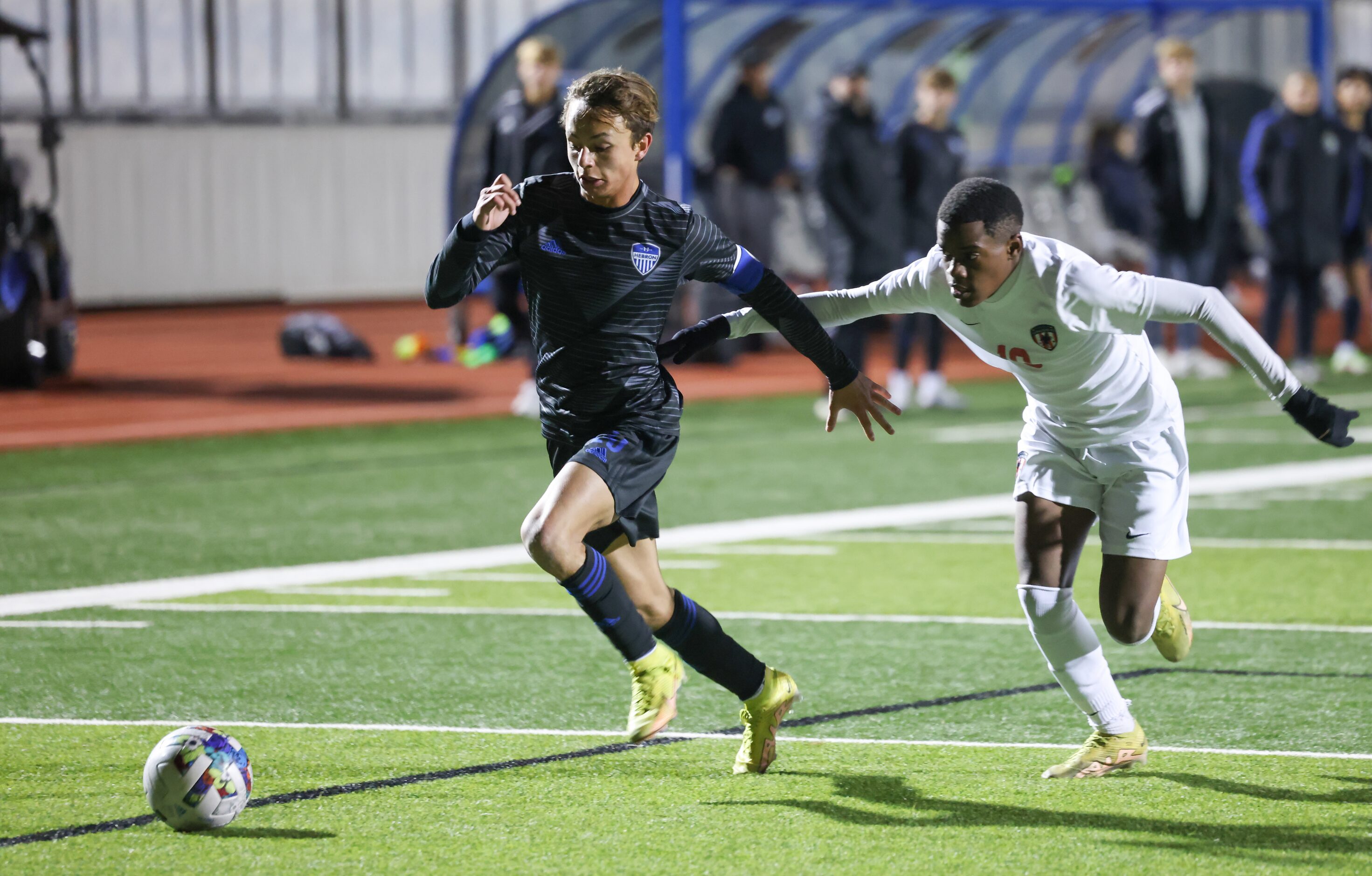 Hebron’s Jet Thomson (23) is chased by Flower Mound Marcus’ Kana Dube (19) as Thomson nears...