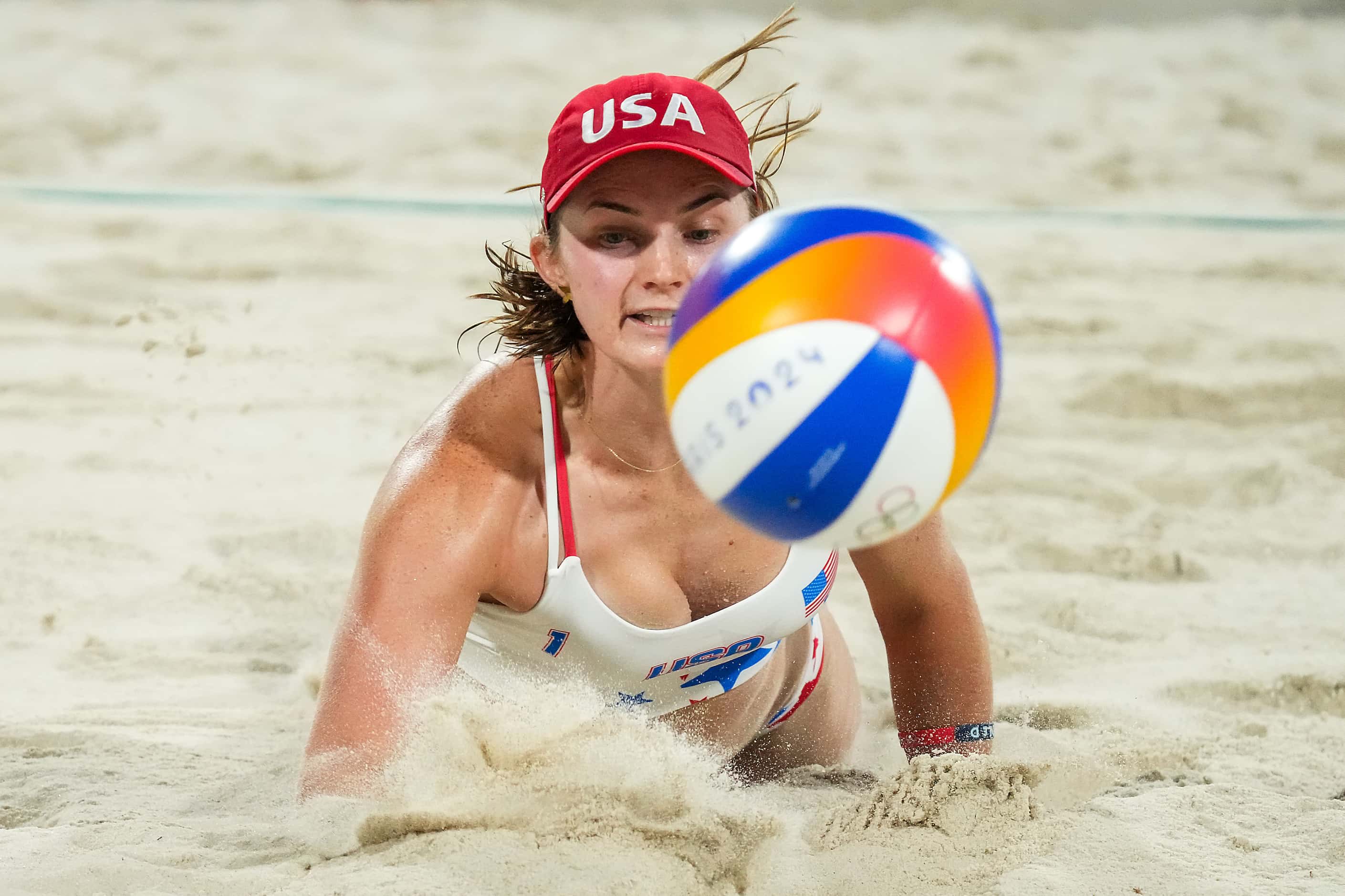 Kristen Nuss of the United States dives for the ball against Australia in women’s beach...