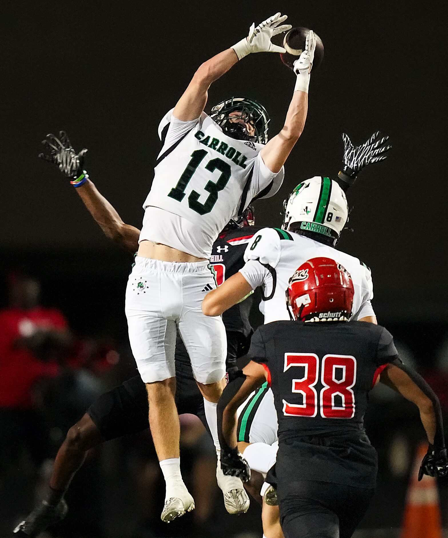 Southlake Carroll defensive back Trey Ferri (13) breaks up a pass intended for Cedar Hill...