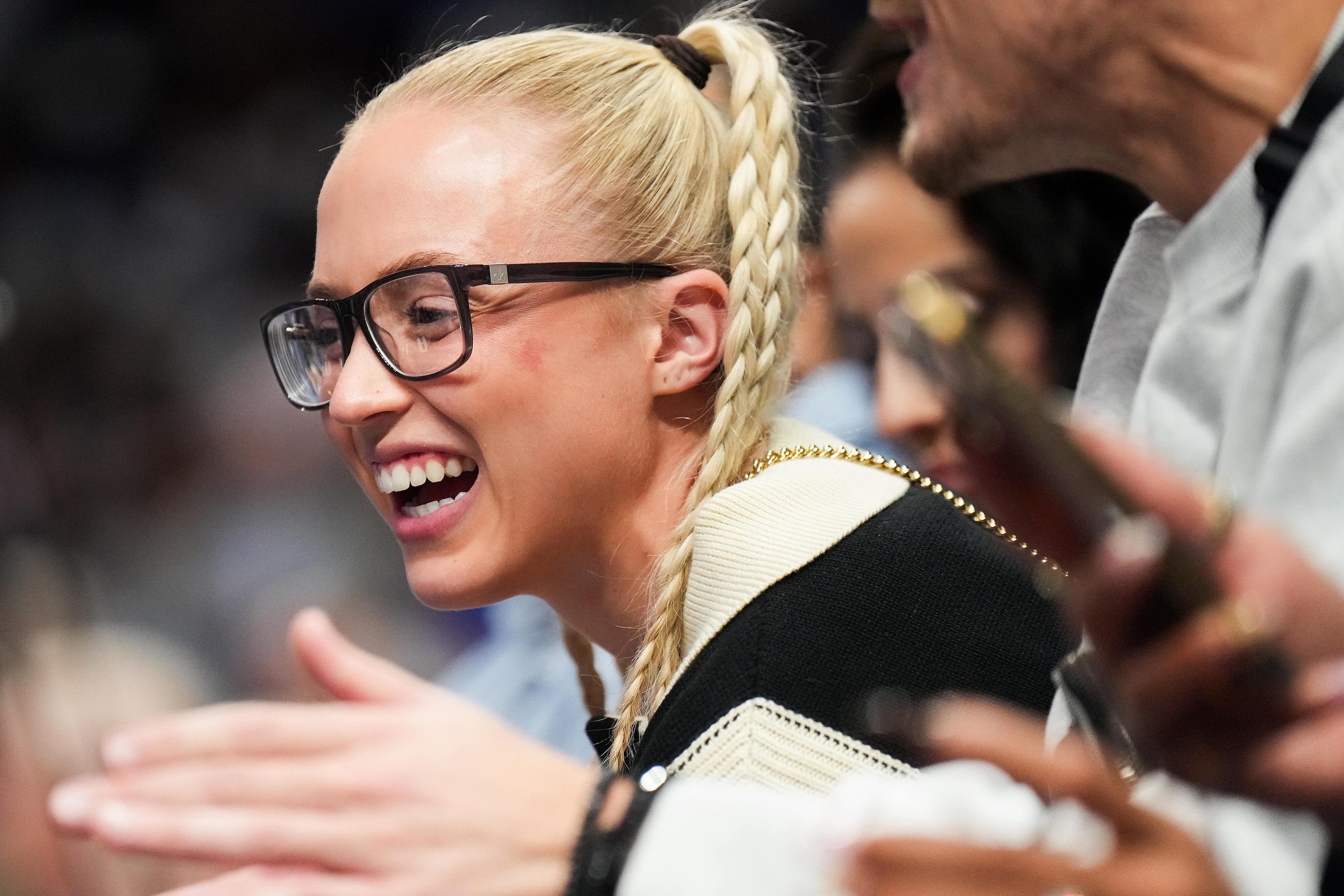 Olympian and TCU basketball player Hailey Van Lith watches during the second half of an NBA...