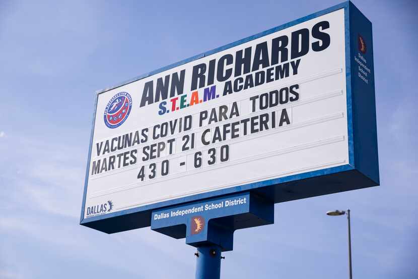 A school sign in Spanish announcing the vaccine clinic on Tuesday, Sept. 21, 2021, at Ann...