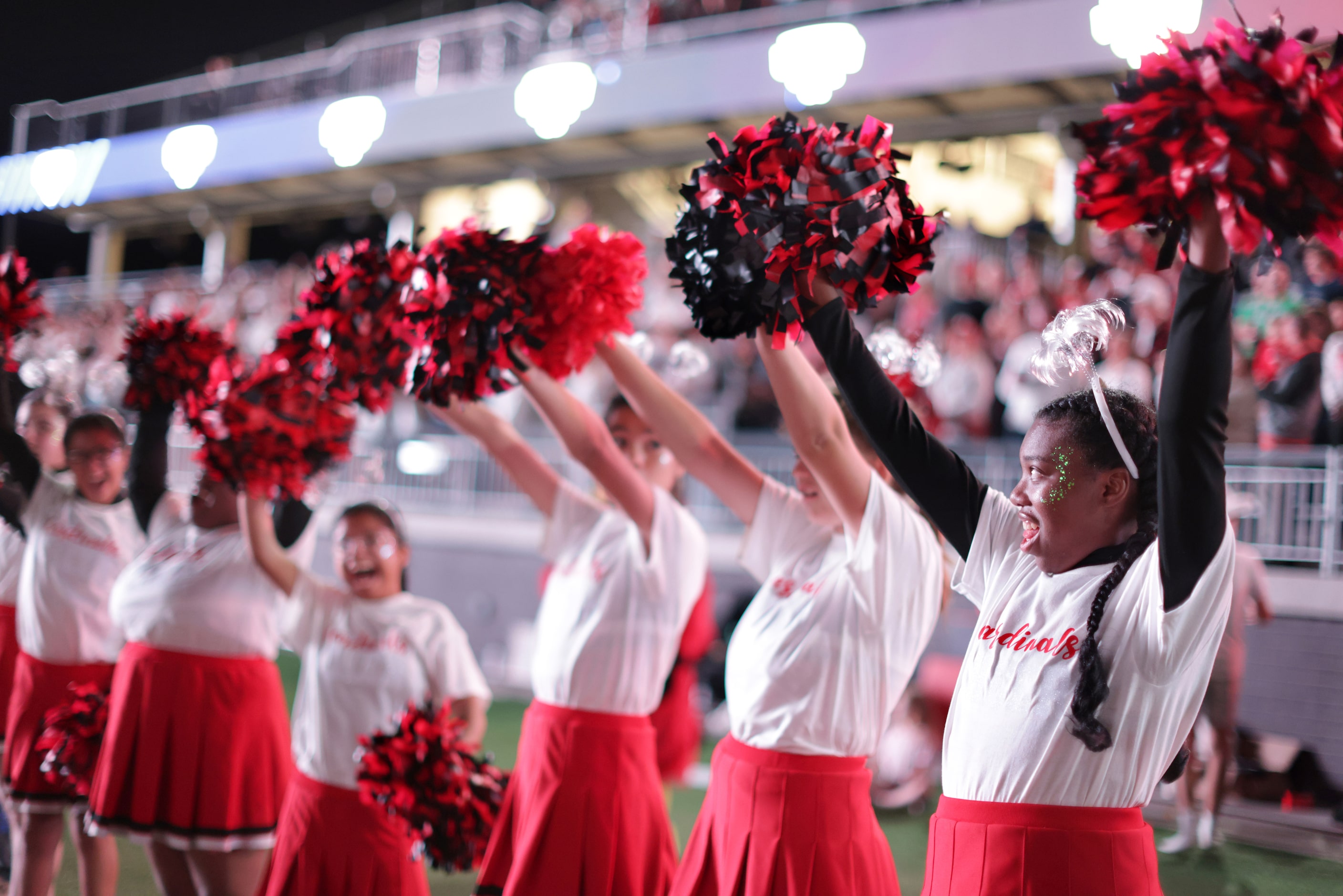 The Melissa Cardinals Cheer Squad gets the crowd pumped during the Prosper Walnut Grove High...