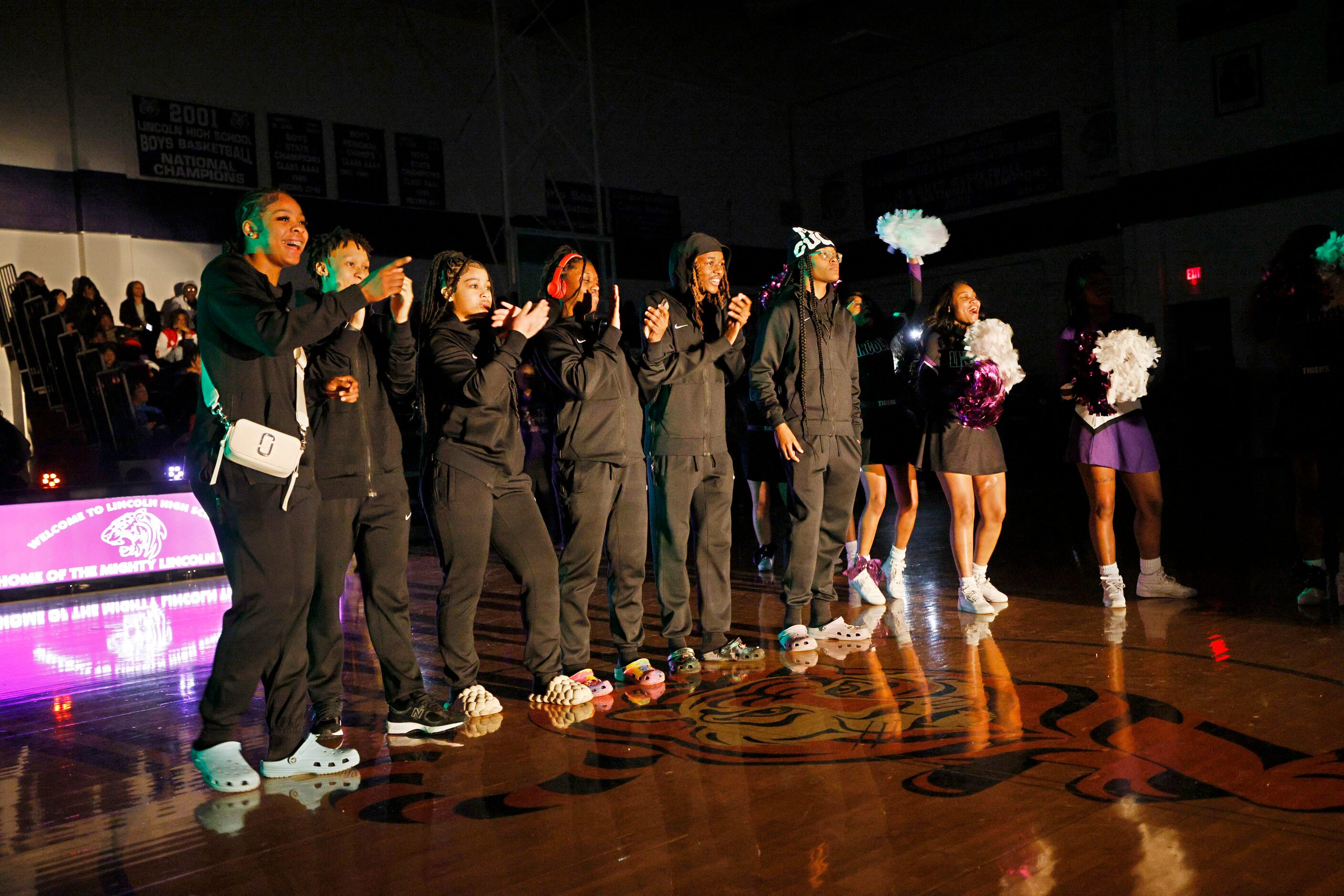 Lincoln High School girls basketball players are introduced during a send-off event for the...