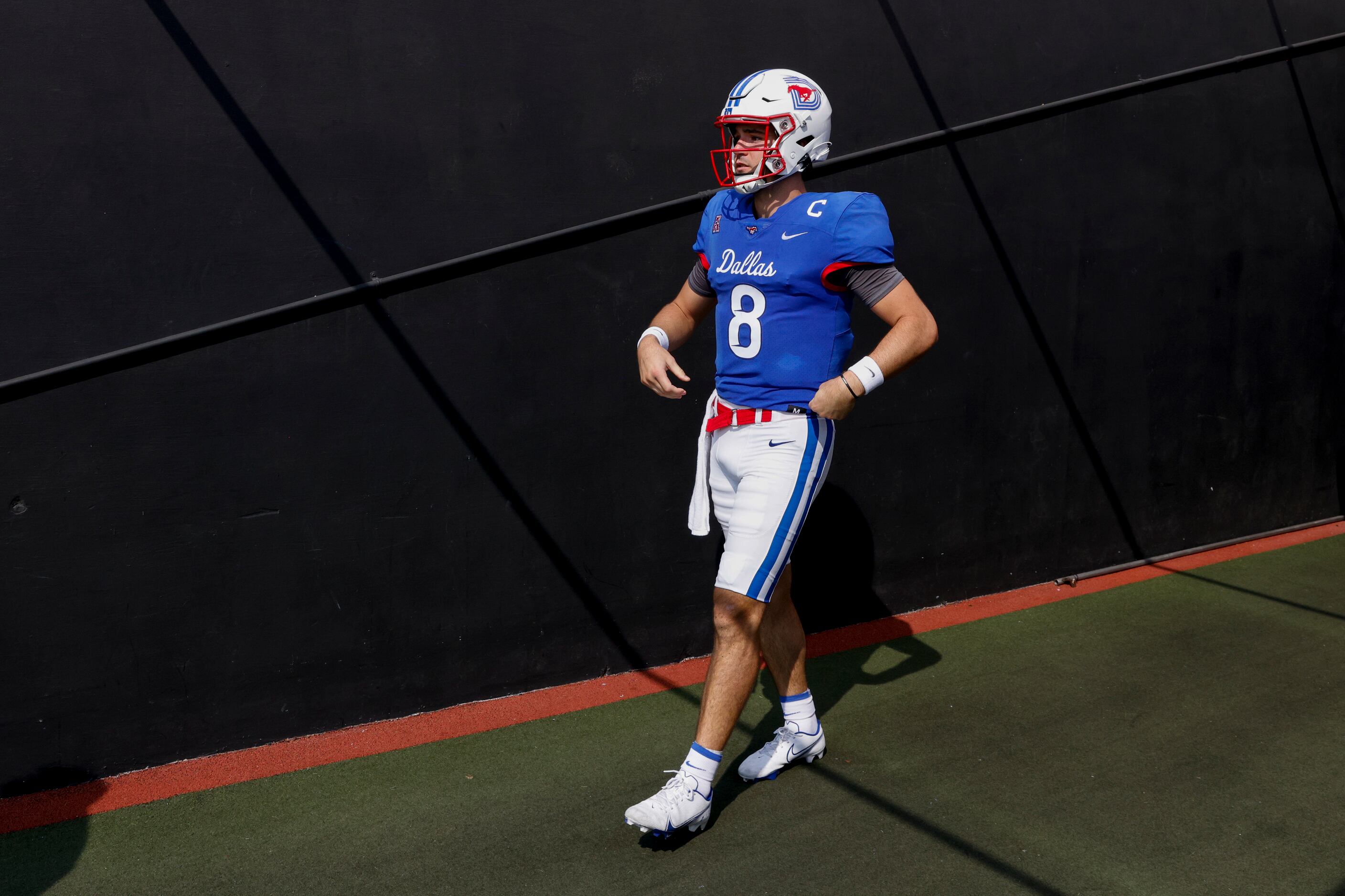 SMU quarterback Tanner Mordecai (8) walks to the field before a game against TCU at Ford...