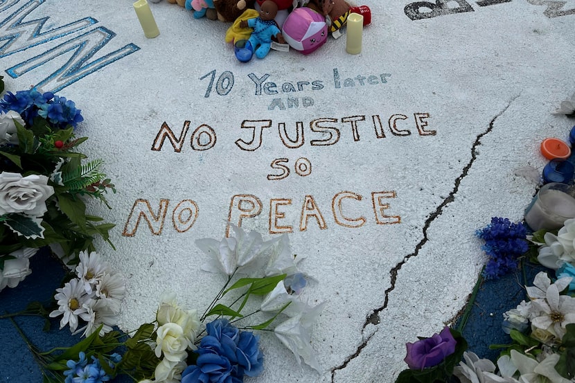 A memorial to Michael Brown is displayed on Canfield Drive in Ferguson, Mo., on Wednesday,...