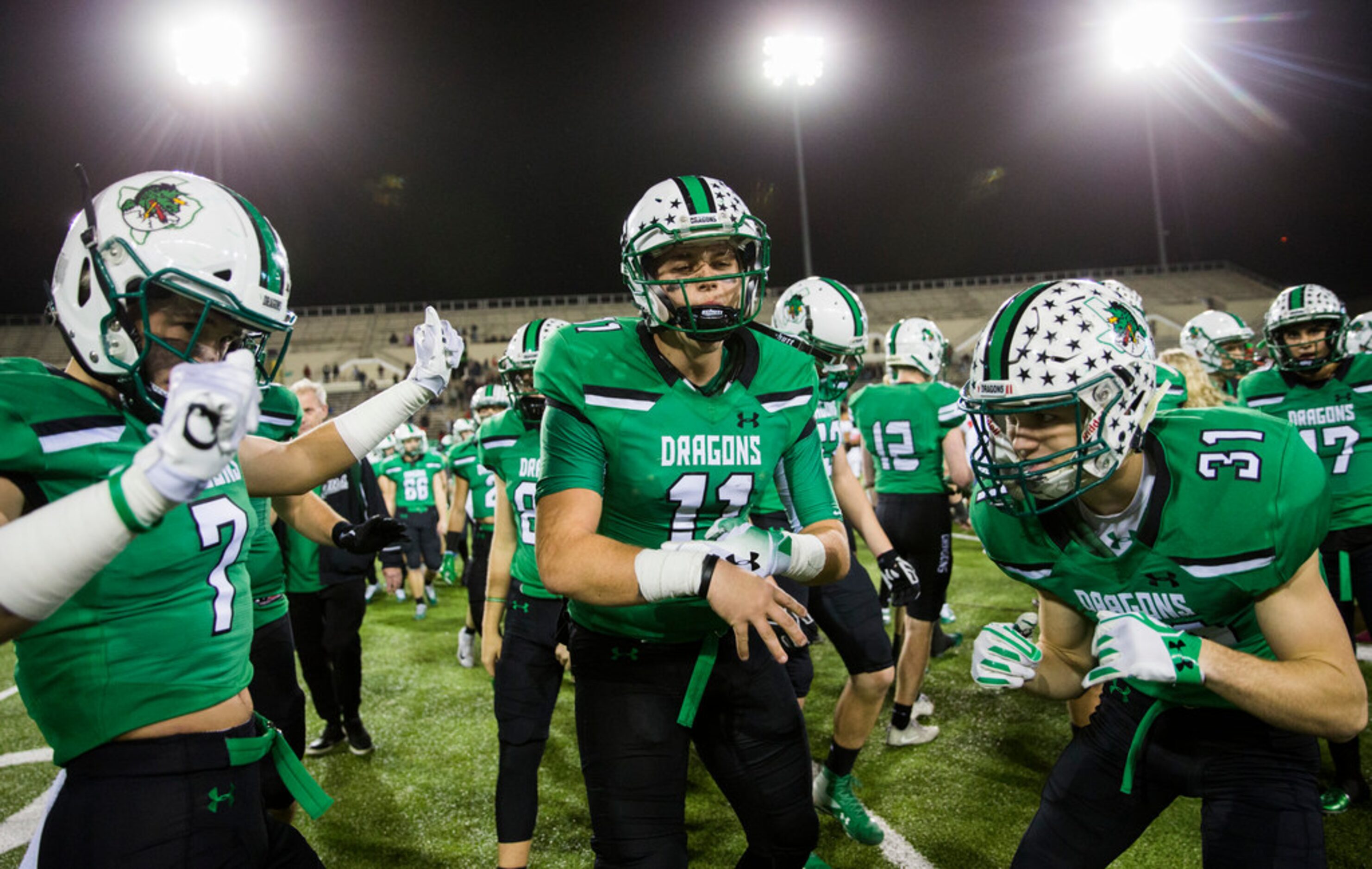 Southlake Carroll football players celebrate a 35-7 win over Euless Trinity on Friday,...