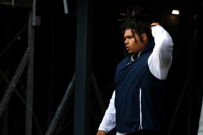 Dallas Cowboys defensive tackle Trysten Hill takes the field during pregame warm ups before...