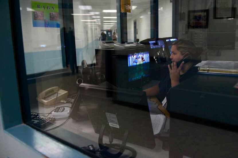 
Rocio Acevedo, transportation officer in the central control area, speaks on the phone at...