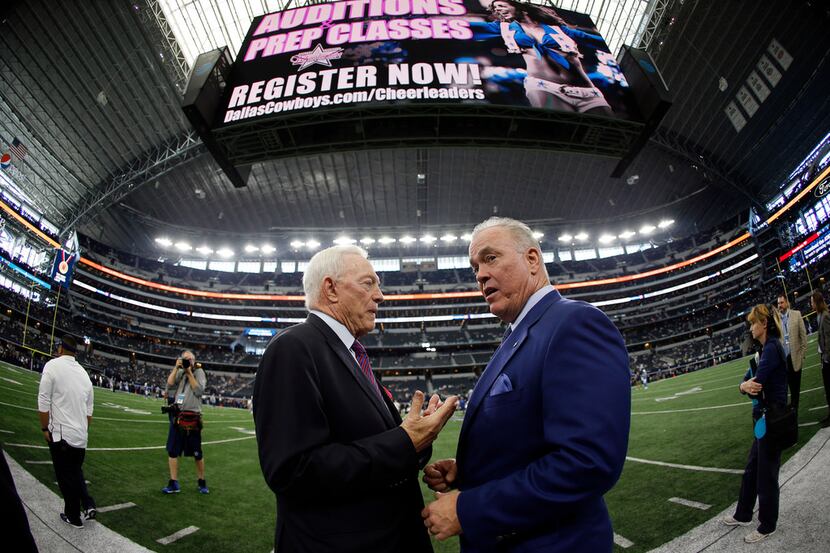 Dallas Cowboys team owner Jerry Jones, left, talks with Chief Operating Officer, Executive...