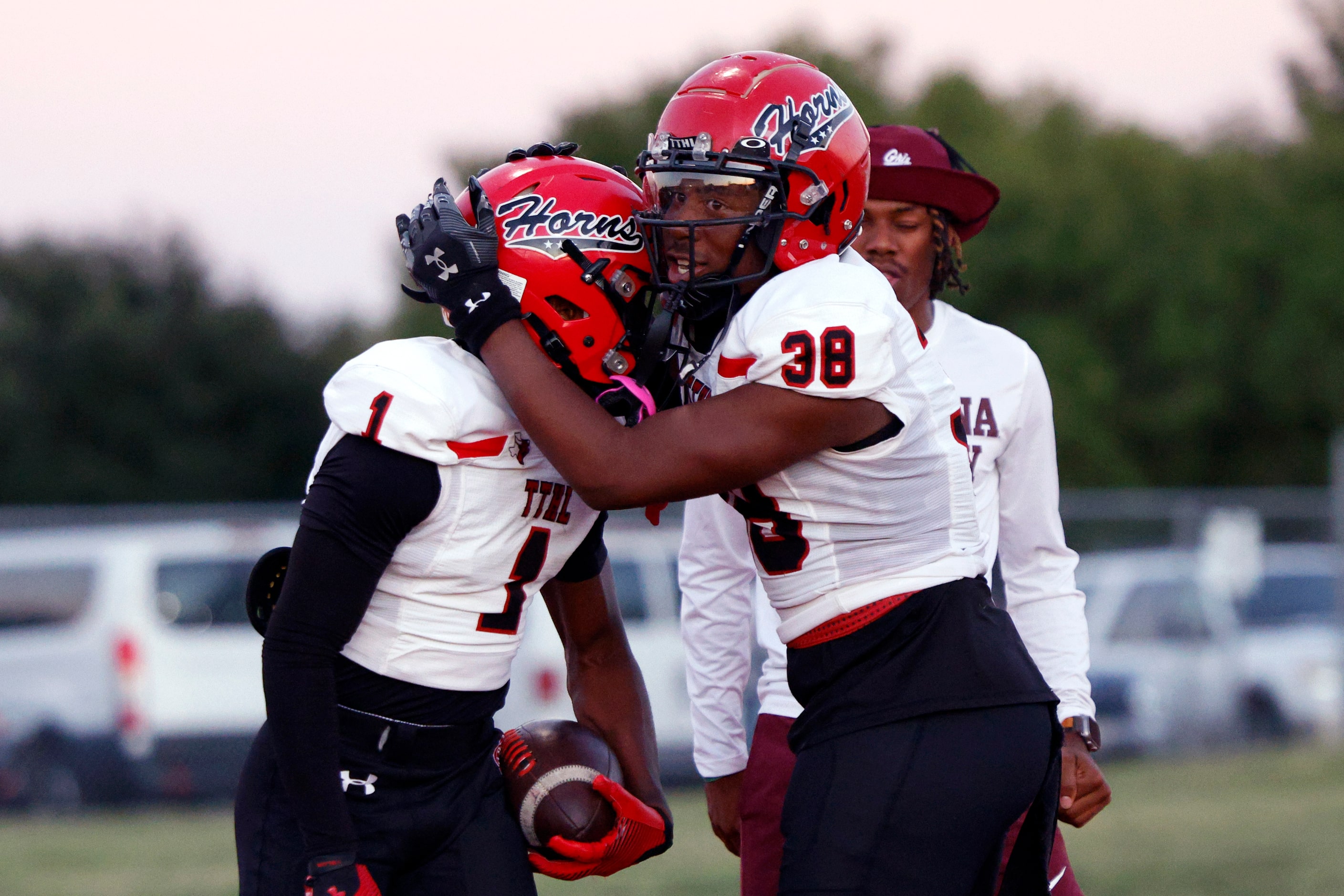 Cedar Hill wide receiver Cedric Mills (1) celebrates his touchdown reception with tight end...