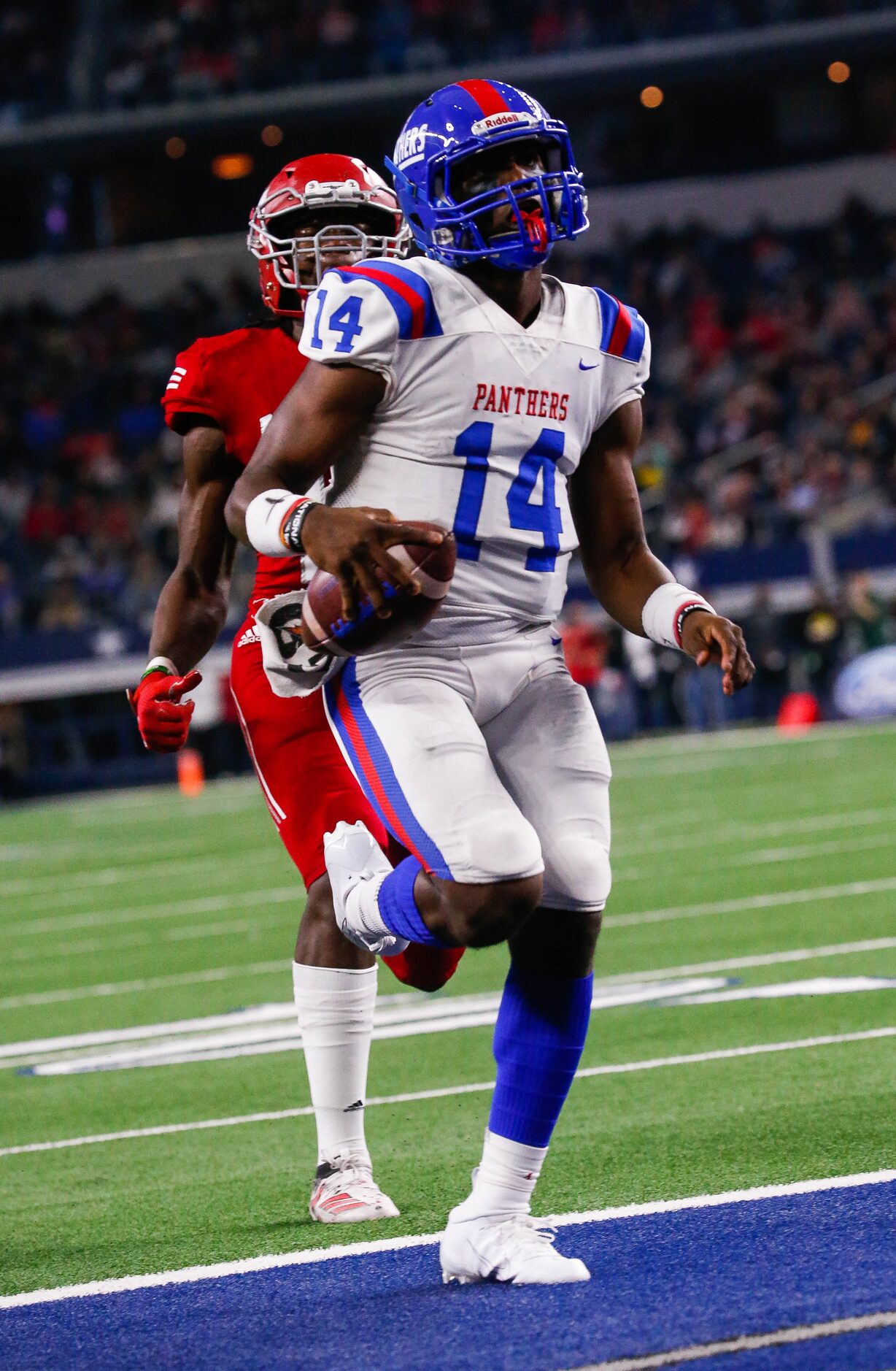 Duncanville's quarterback Chris Parson runs in for a touchdown in the second quarter of a...