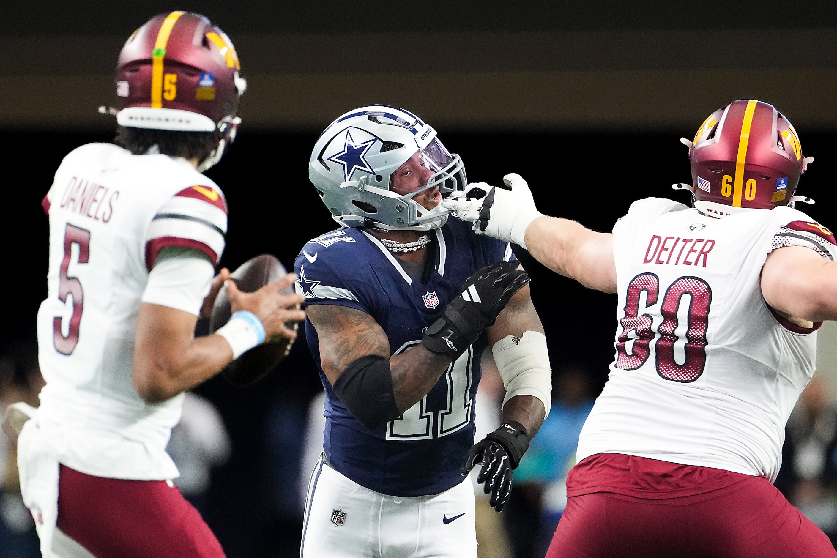 Dallas Cowboys linebacker Micah Parsons (11) gets past Washington Commanders guard Michael...