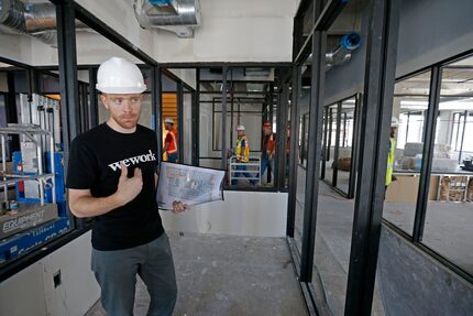 Adam Wacenske, general manger of the WeWork's south region, shows off WeWork's two-floor...