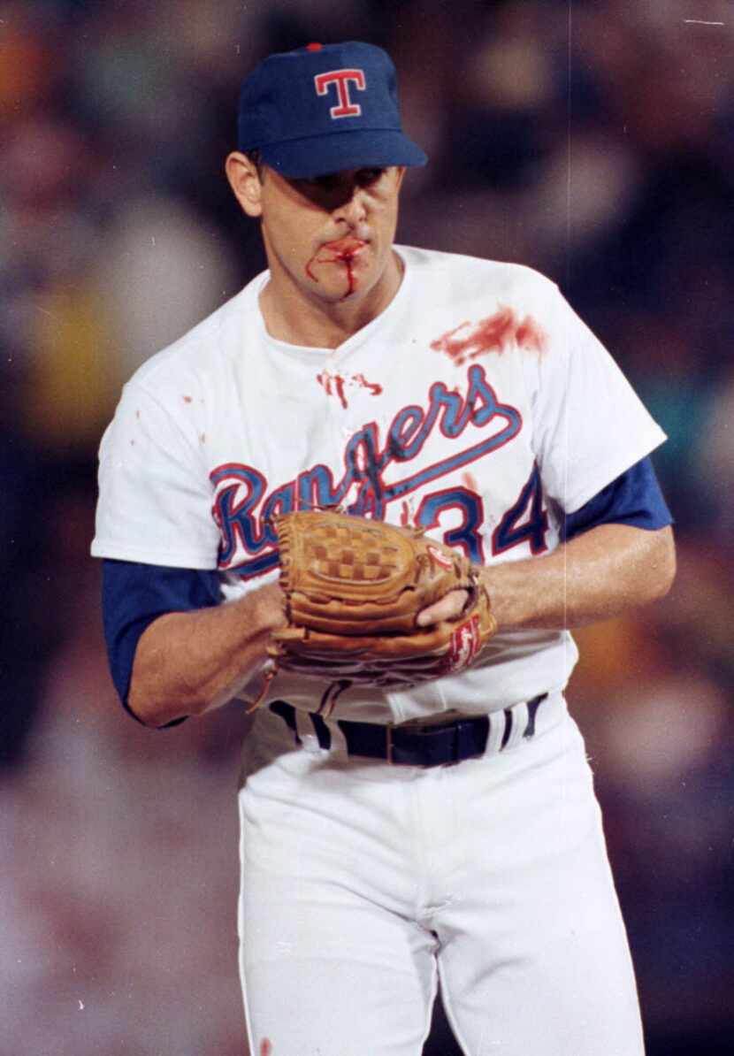 Texas Rangers pitcher Nolan Ryan suffered a bloody lip when hit by a one-hop bouncer off the...