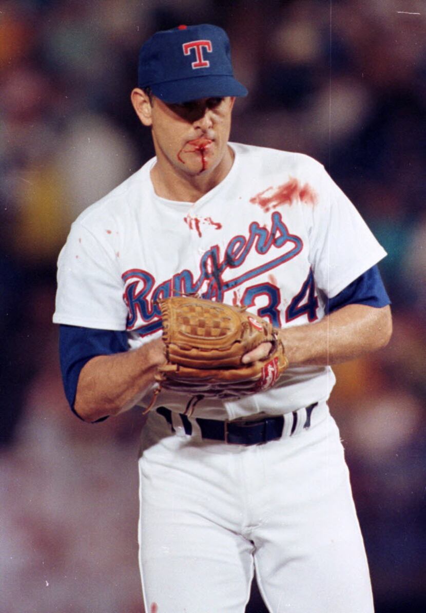 Texas Rangers pitcher Nolan Ryan suffered a bloody lip when hit by a one-hop bouncer off the...