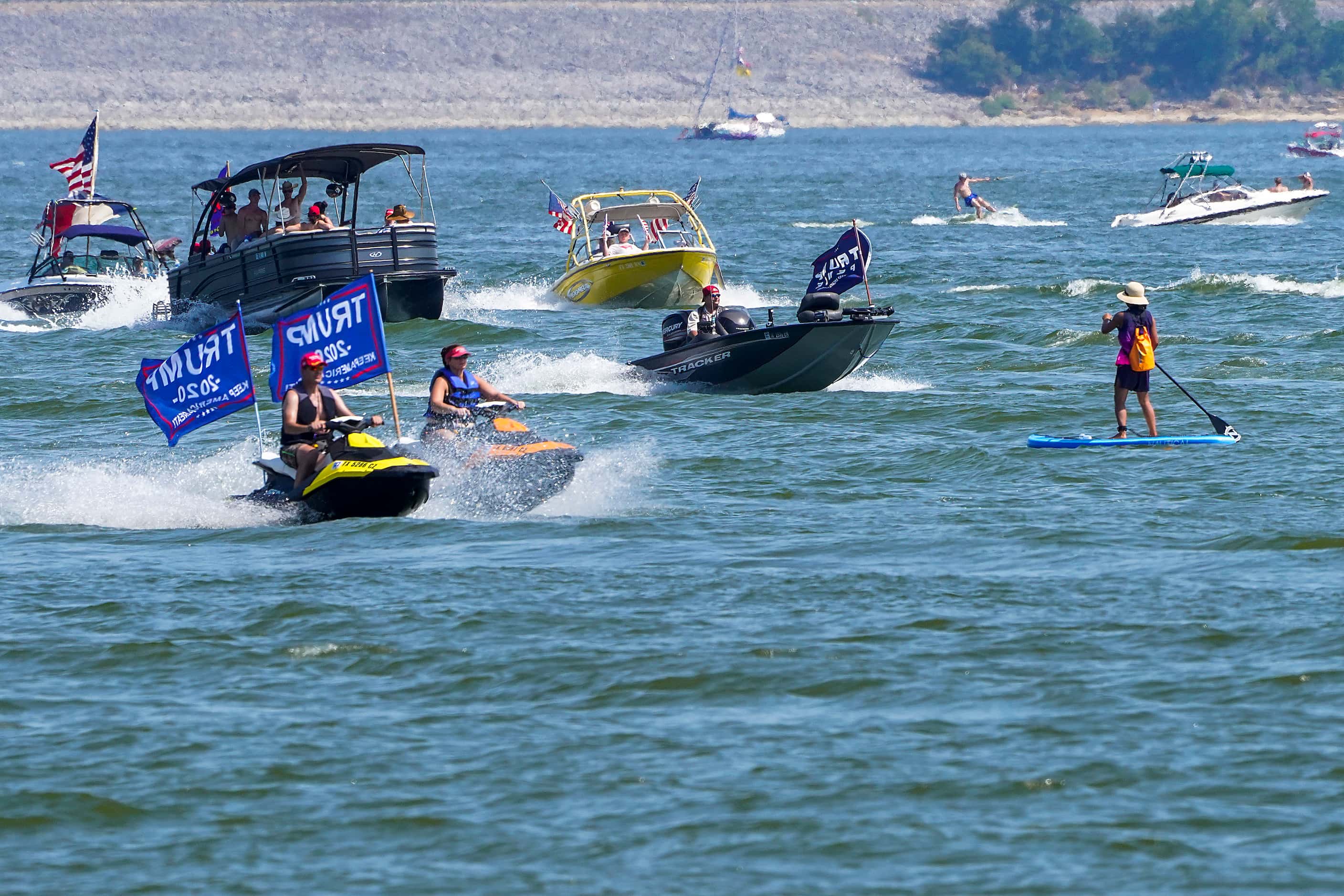 Boaters in support of President Donald Trump parade around Grapevine Lake near Murrell Park...