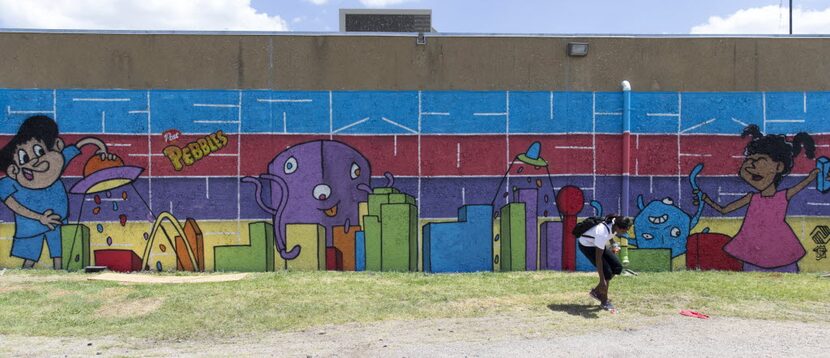 The finished mural designed by artist Daniel Yanez at Oak Cliff Boys & Girls Club. The...