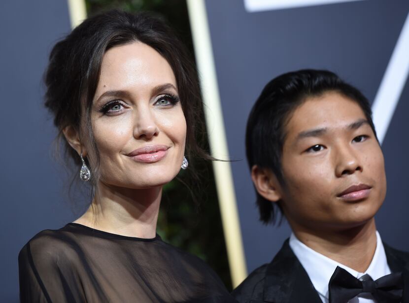Angelina Jolie and her son Pax arrive for the 75th Golden Globe Awards on January 7, 2018,...