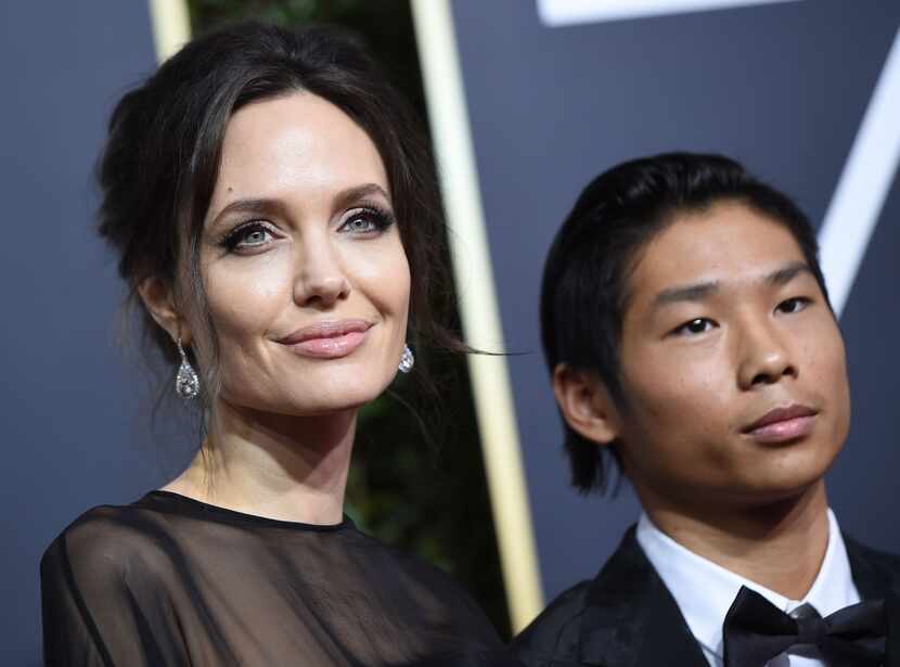 Angelina Jolie and her son Pax arrive for the 75th Golden Globe Awards on January 7, 2018,...