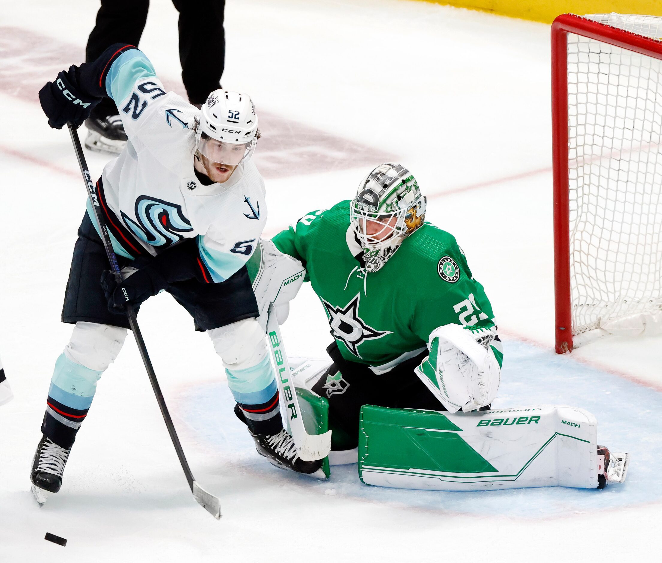 Seattle Kraken left wing Tye Kartye (52) misses a backhand shot against Dallas Stars...