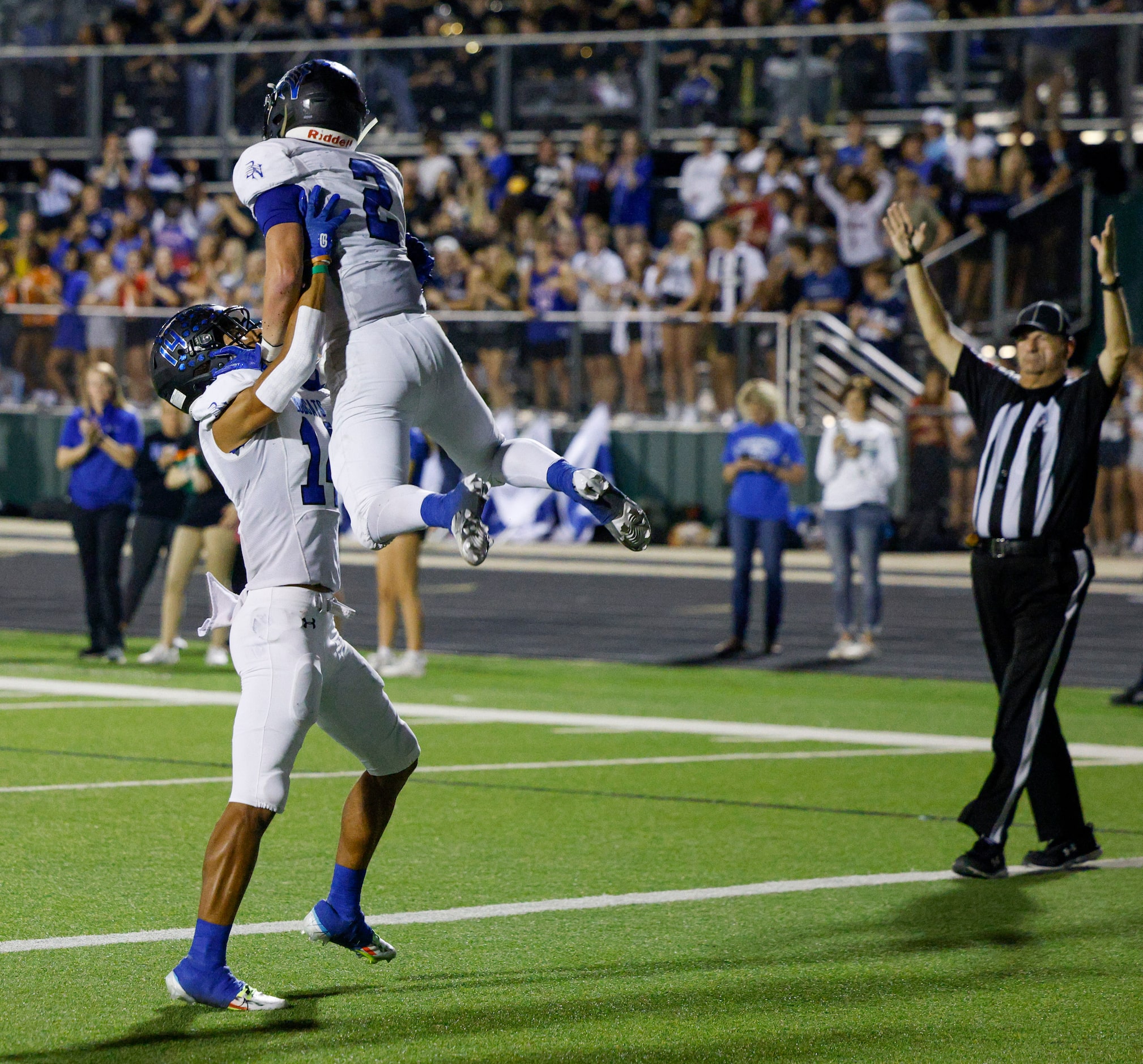 Trophy Club Byron Nelson wide receiver Landon Ransom-Goelz (14) lifts running back Aaron...