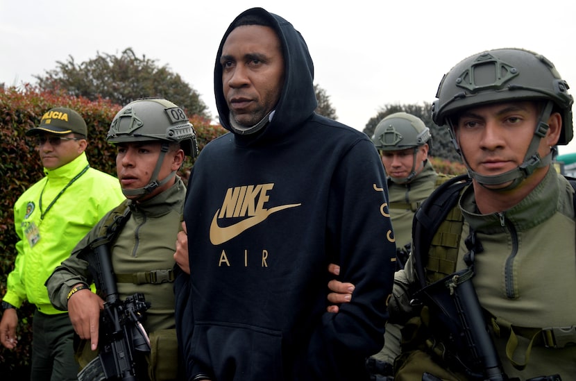 Colombia's former national football team player Jhon Viafara is heavily escorted upon...