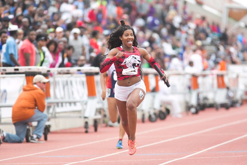 Mesquite Horn anchor Kaylor Harris, center, celebrates as she crosses the finish line during...