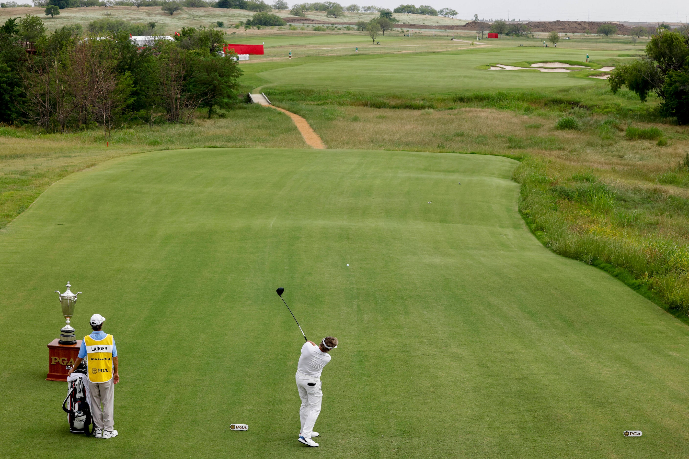 Bernhard Langer of Germany tees off on the first hole during the first round of the 83rd...