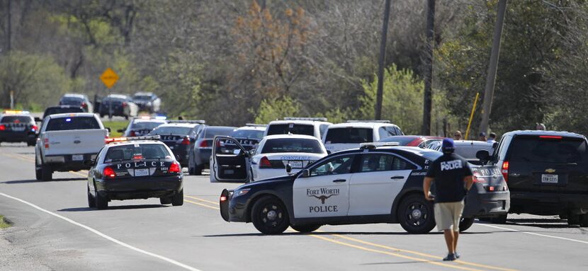 A 2016 file photo of Fort Worth police near the scene where an officer was shot in a gun...