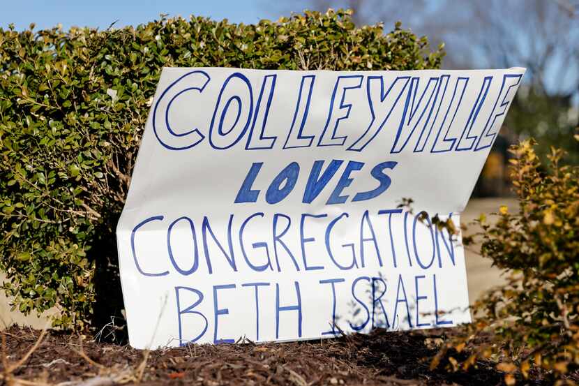A sign shown in the bushes outside Congregation Beth Israel pictured Jan. 22 in Colleyville....