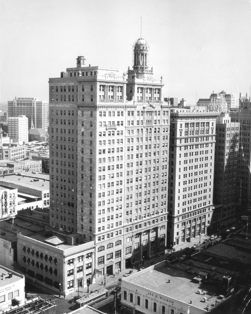 The headquarters of the Republic (left) and First National (right) banks separated by "Money...