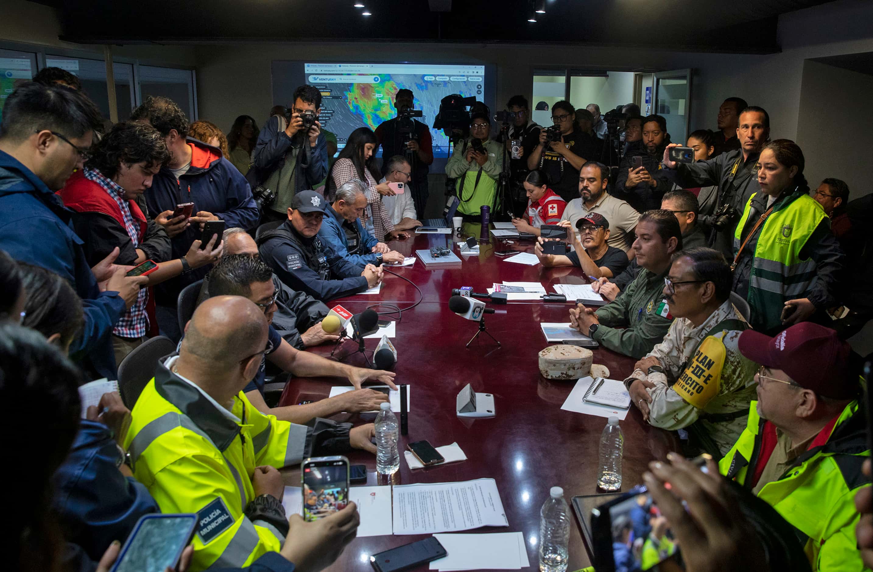 A briefing with city officials is given during an emergency meeting with Tijuana city...