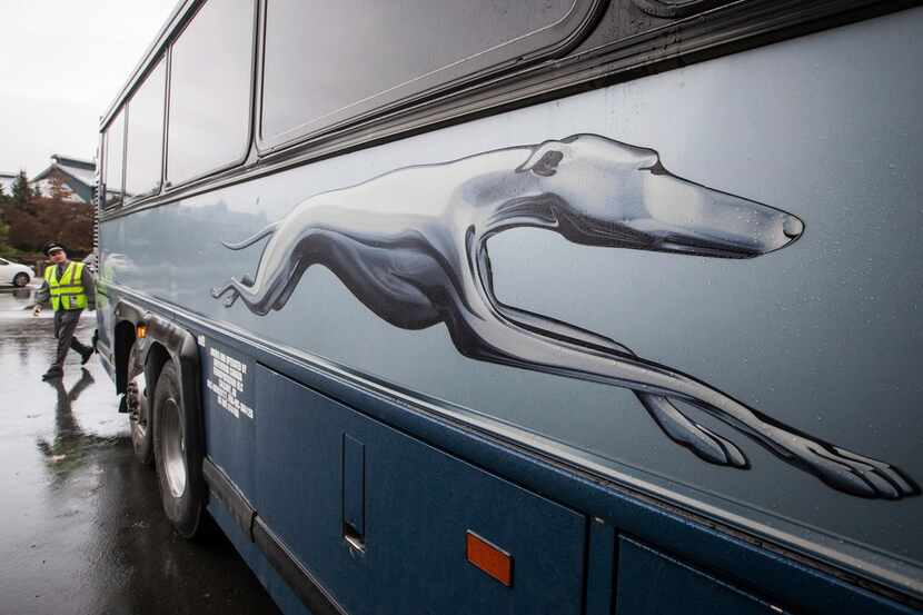 Greyhound bus driver Brent Clark, who has been with the company since 1983, does a...