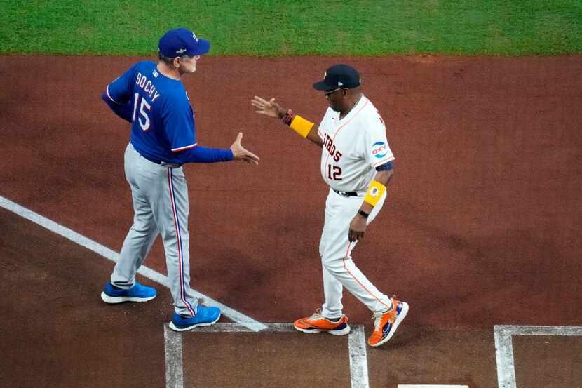 Texas Rangers manager Bruce Bochy (left) and Houston Astros manager Dusty Baker shakes hands...