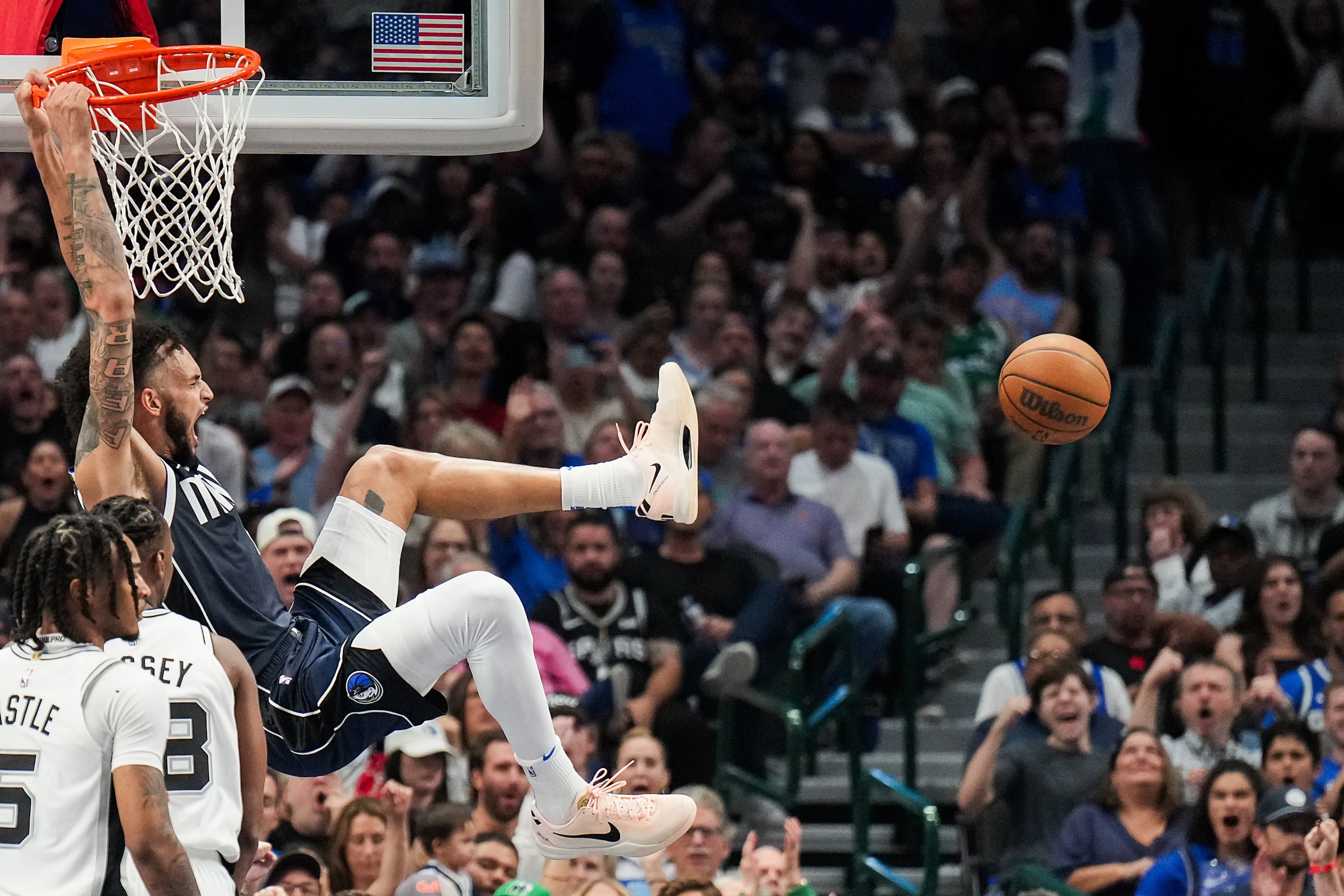 Dallas Mavericks center Dereck Lively II (2) dunks the ball past San Antonio Spurs center...