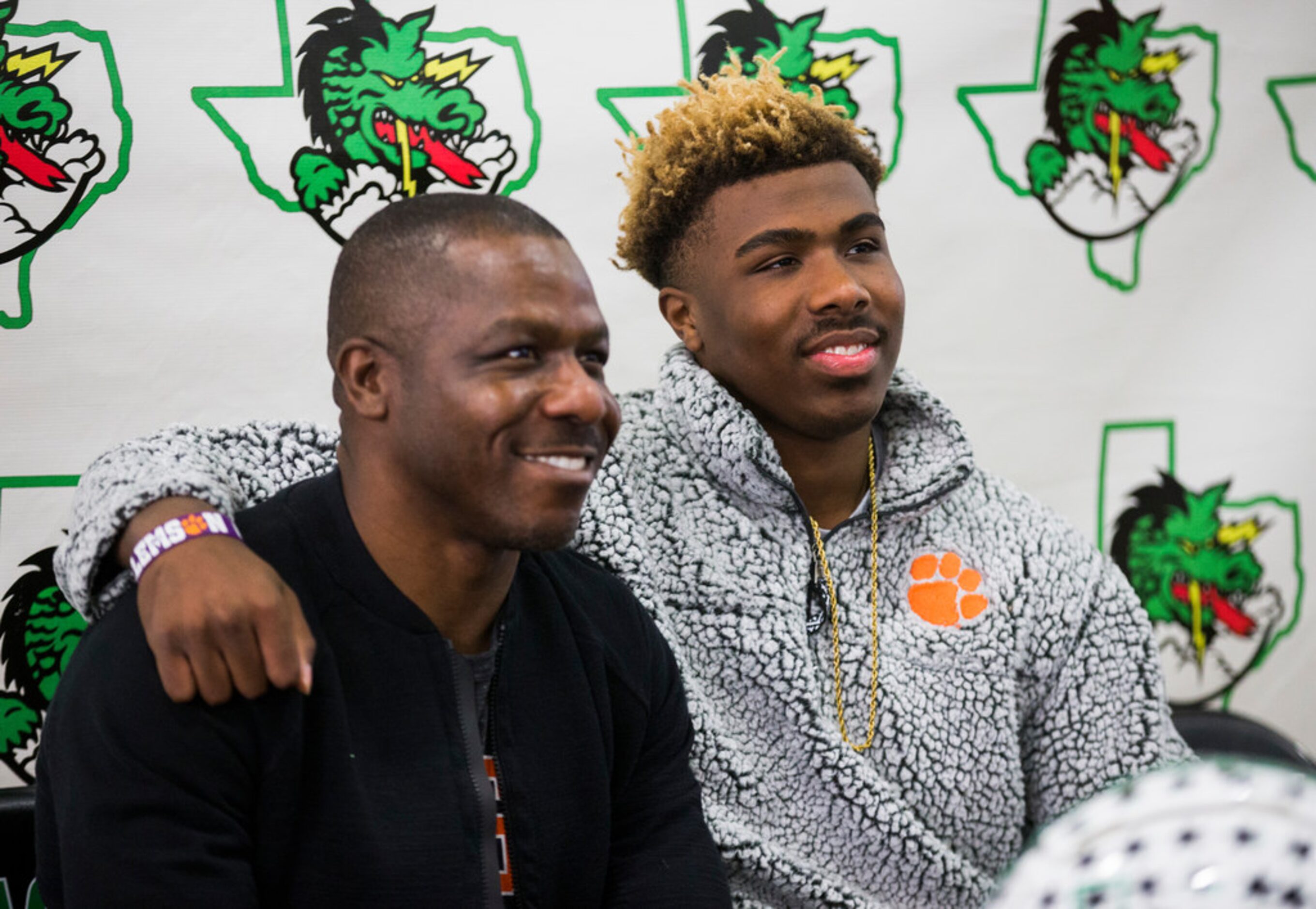 Southlake Carroll football player RJ Mickens (right) poses for a photo with his father, Ray...