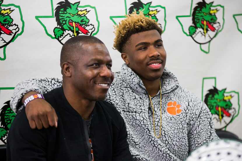 Southlake Carroll football player RJ Mickens (right) poses for a photo with his father, Ray...