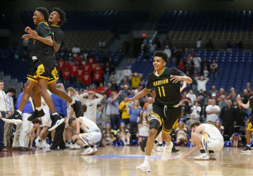 Madison's Jerome Henry #11 runs down cour as he is joined by Madison's Dyeshun King #5 ,on...