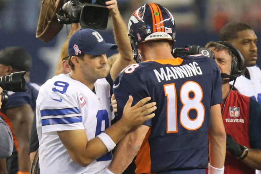 Denver Broncos quarterback Peyton Manning (18) and Dallas Cowboys quarterback Tony Romo (9)...
