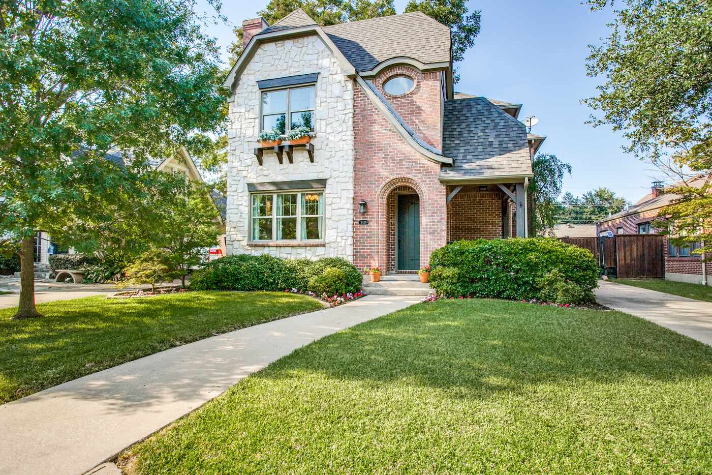 This M-Street tudor at 5831 Morningside Avenue in Dallas includes a guest quarters complete...