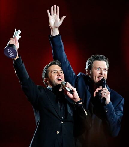Luke Bryan (left) and Blake Shelton celebrate Bryan's winning of Entertainer of the Year...
