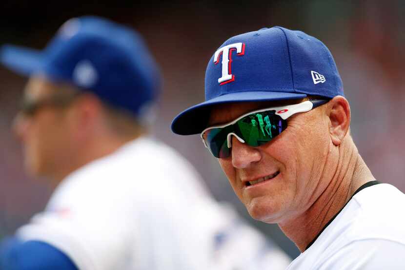 Texas Rangers manager Jeff Banister (28) cracks a smile during their Opening Day game...