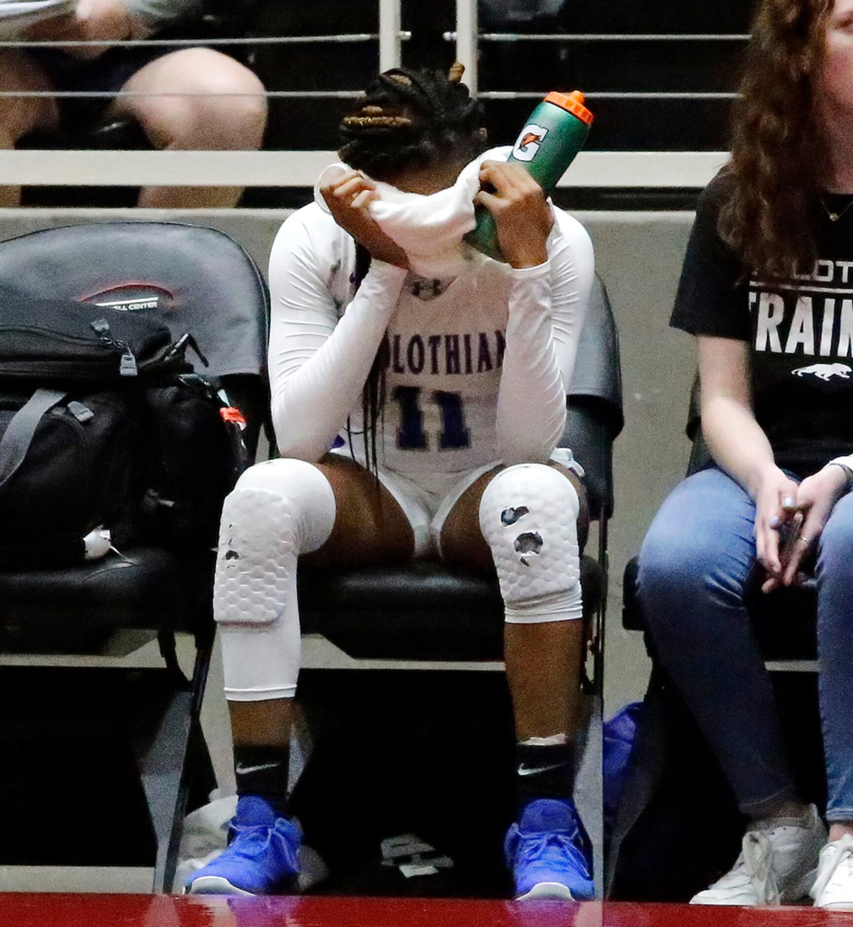 Midlothian High School guard Maykayla Jackson (11) reacts after fouling out in overtime as...