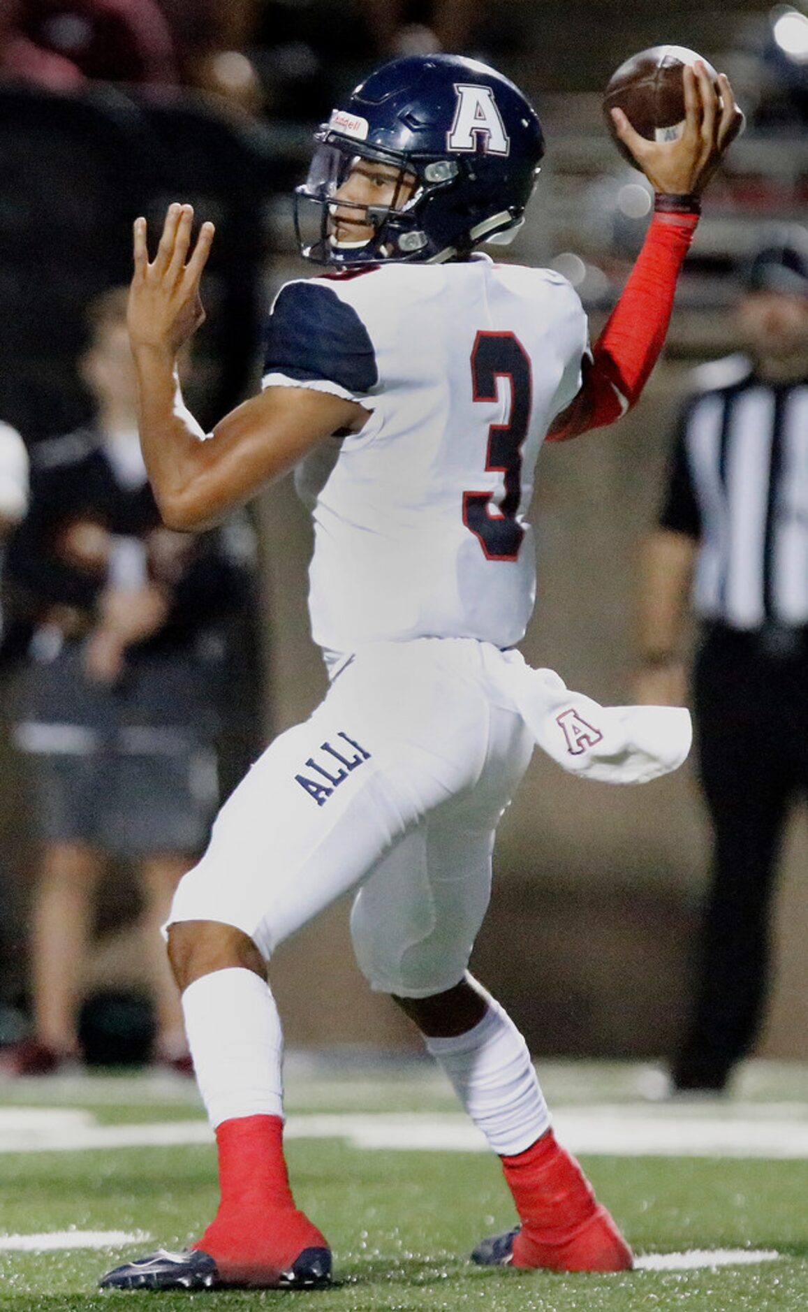 Allen High School quarterback Raylen Sharpe (3) throws a pass during the first half as Plano...